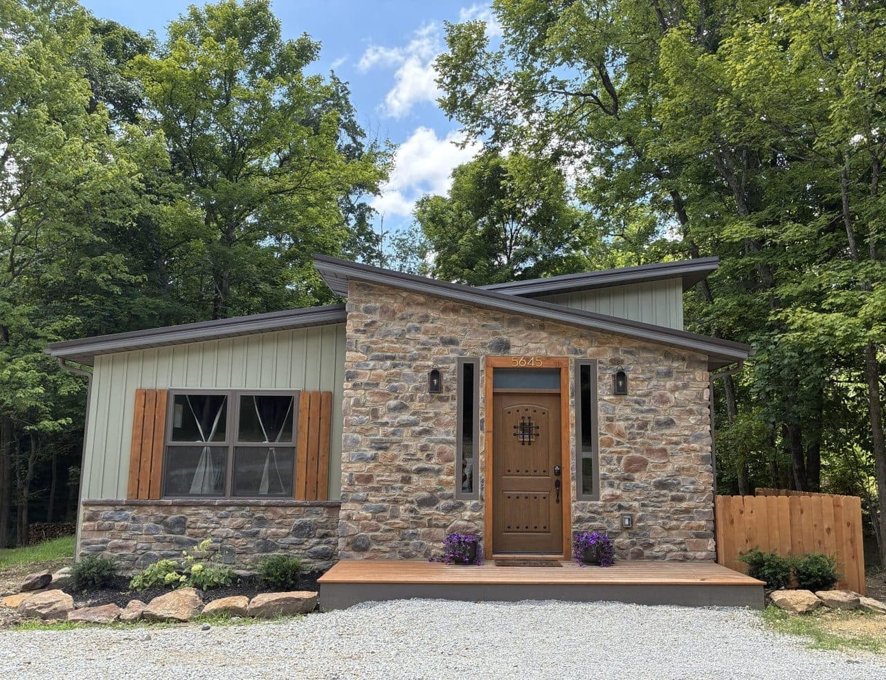 Four homes at the same $425K budget: a Hocking Hills designer cabin, a downtown Red Lodge house, a Bay St. Louis raised cottage, and a Haines Falls six-bedroom compound