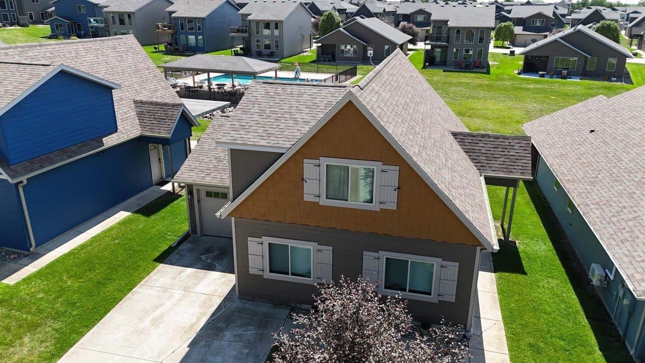 An aerial view of a resort cabin beside a pool at Bridges Bay Resort on East Lake Okoboji in Arnolds Park, Iowa — one of four homes at the same $475K budget