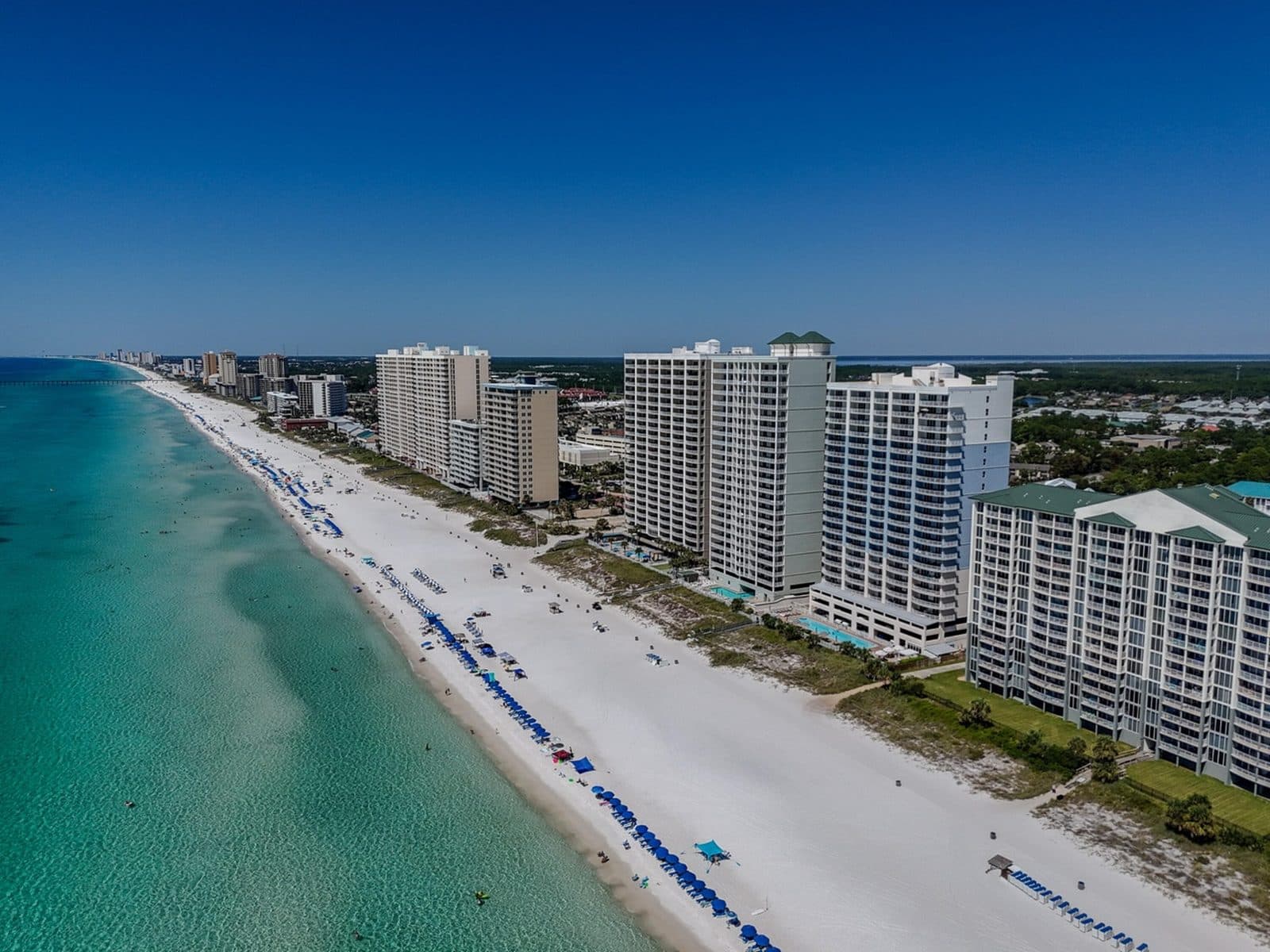 Four homes at the same $700K budget: a Fredericksburg rental cottage, a Lincoln NH townhouse, a downtown Winter Park condo, and a Gulf-front Panama City Beach condo