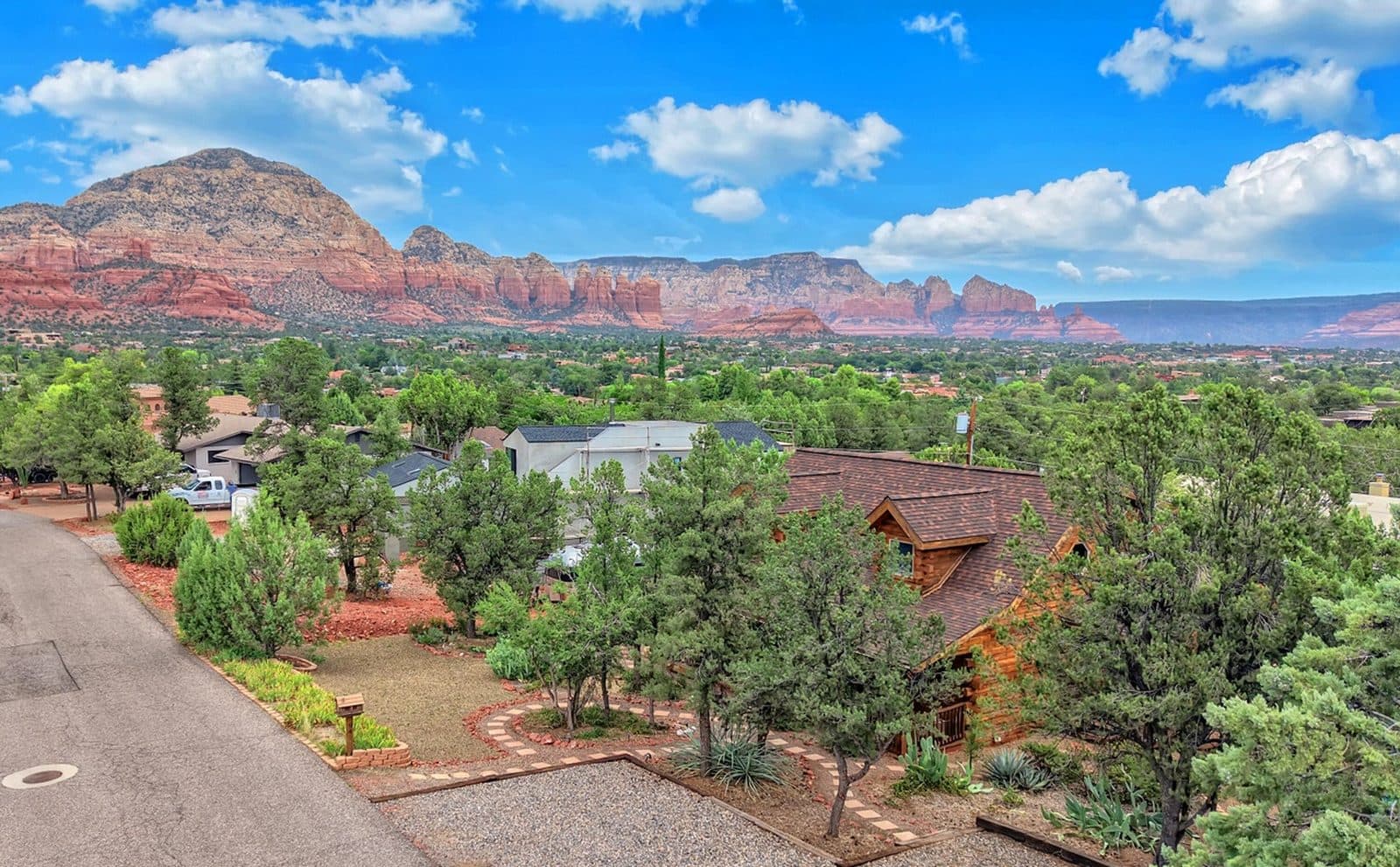 Four homes at the same $750K budget: a Sedona log cabin under the red rocks, a Pagosa Springs chalet, a Maine beach cottage, and a North Myrtle Beach pool home
